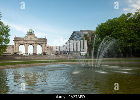 Shot of fountain in Park of the Fiftieth Anniversary. Triumphal Arch on the background Stock Photo