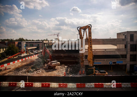 Workers Tear Down The Parking Garage On 4th Street Monday