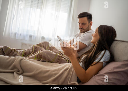 Man is offended and angry because his wife is neglecting him. Stock Photo