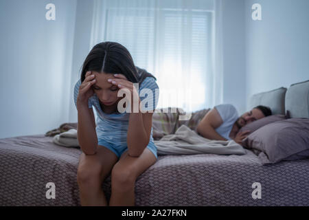 Young woman is having trouble with sleep. Stock Photo
