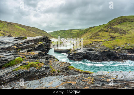 Spectacular views from the top of Warren point looking towards Boscastle Harbour entrance and the village beyond, North Cornwall, England, UK. Stock Photo