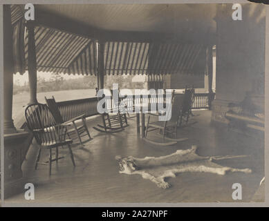 President Roosevelt's country home, Sagamore Hill in Oyster Bay, New York, view of porch with mountain lion skin on floor Stock Photo