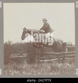 President Theodore Roosevelt on horseback, jumping over a fence Stock Photo