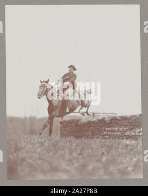 President Theodore Roosevelt on horseback jumping over wall Stock Photo