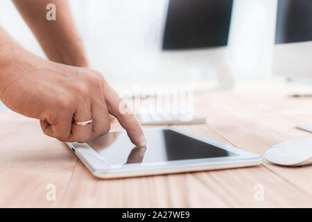 cropped image of man using a digital tablet. Stock Photo