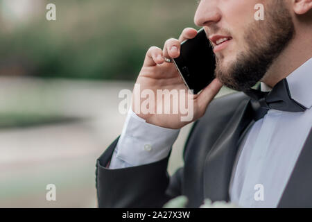 close up. confident business man talking on mobile phone Stock Photo
