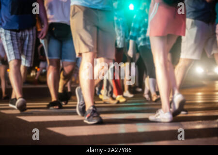 People crossing the road on zebra crossing. Stock Photo
