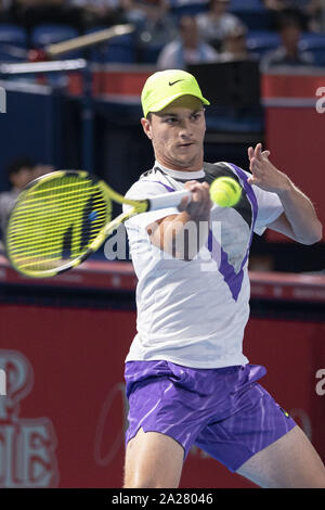 Tokyo, Japan. 1st Oct, 2019. Miomir Kecmanovic (SRB) hits a return against Denis Shapovalov (CAN) during their men's singles first-round match at the Rakuten Japan Open Tennis Championships 2019 at Ariake Colosseum. The tournament is held from September 30 to October 6. Credit: Rodrigo Reyes Marin/ZUMA Wire/Alamy Live News Stock Photo