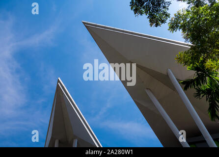 Triangle shapes of the roof of the modern building and bright blue sky Stock Photo