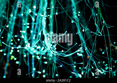 Indoor string lights hanging in the dark. Stock Photo