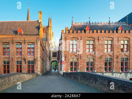 Belgium, West Flanders (Vlaanderen), Bruges (Brugge). Brugse Vrije and buildings along the Groenerei canal at dusk. Stock Photo