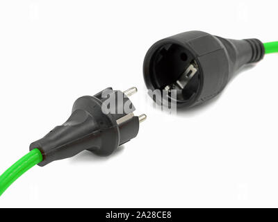 close up, disconnected green electrical power extension cable with EU plug, green energy Stock Photo