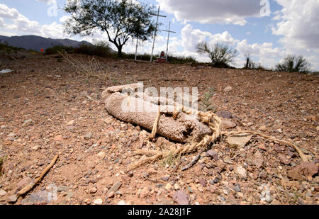 A carpet shoe or shoe covering that is typically used by smugglers on foot to disrupt tracking by law enforcement sits along reservation Route 30 in t Stock Photo