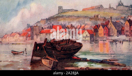A very old colour postcard captures a scene in the upper harbour of Whitby,North Yorkshire, UK with a coble (pronounced cobbel) lying on its side.Over the River Esk can be seen the Parish Church, Abbey, St Michael's Church and Church Street. Stock Photo