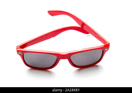 Red plastic glasses with tinted dirty glasses. isolated on a white background. Stock Photo