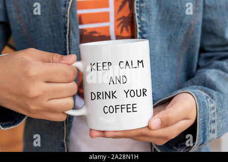 Inspirational quote on coffee mug - Keep calm and drink your coffee. Stock Photo
