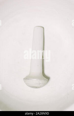 Pharmacy white porcelain mortar and pestle set. Stock Photo