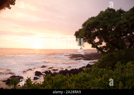 Colorful sunset over the sea in Heavenly Kona on Big Island Hawaii Stock Photo