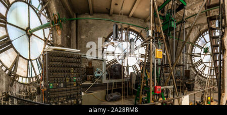 Vintage gravity driven clock tower mechanisms and dials. Stock Photo