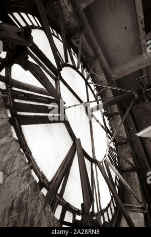 Vintage gravity driven clock tower mechanisms and dials. Stock Photo