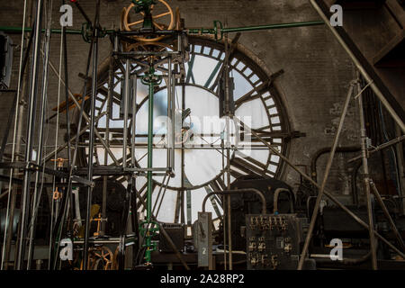 Vintage gravity driven clock tower mechanisms and dials. Stock Photo