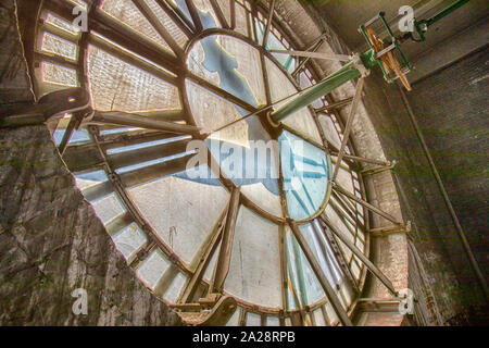 Vintage gravity driven clock tower mechanisms and dials. Stock Photo