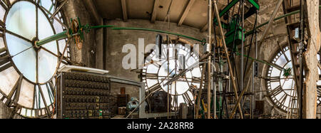 Vintage gravity driven clock tower mechanisms and dials. Stock Photo