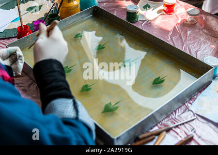 Ebru Art.The traditional art of painting on the water. Process of creating drawings in ebru technique.Paper marbling Stock Photo
