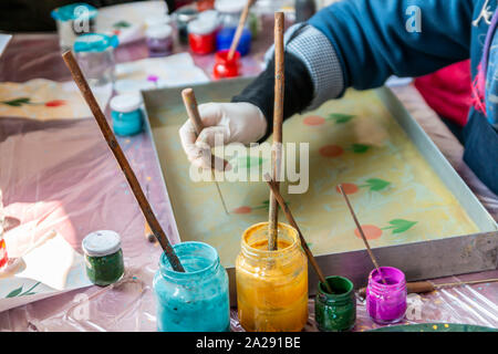 Ebru Art.The traditional art of painting on the water. Process of creating drawings in ebru technique.Paper marbling Stock Photo