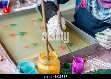 Ebru Art.The traditional art of painting on the water. Process of creating drawings in ebru technique.Paper marbling Stock Photo