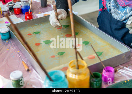 Ebru Art.The traditional art of painting on the water. Process of creating drawings in ebru technique.Paper marbling Stock Photo