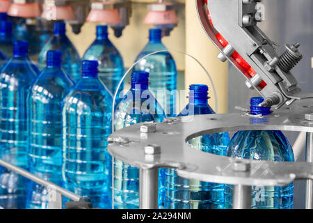 The line at the factory for the production of plastic bottles Stock Photo