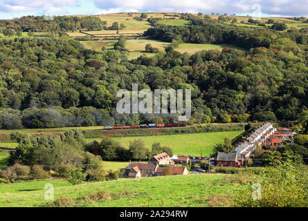 S160 2253 Omaha passes the Esk Valley cottages on the NYMR. Stock Photo