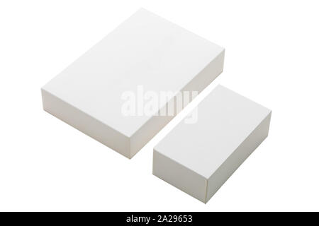 Two cardboard square boxes in two sizes, bigger box set on smaller one, cut out on white background. A white cardboard boxes on a white background Stock Photo