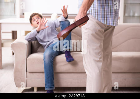The father beating and punishing his sone Stock Photo