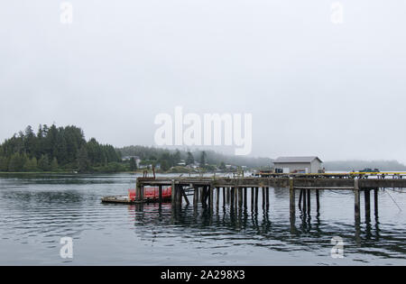 Small Dock for fishing boats in the middle of the Village at early morning Stock Photo