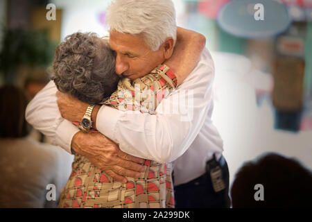 Portrait of an elderly couple embracing. Stock Photo