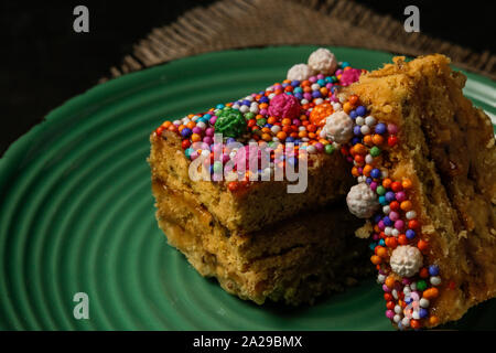 Peruvian classic dessert, turron de Doña pepa with honey and candies Stock Photo