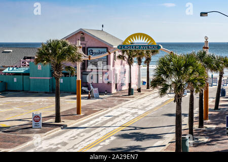 Car entrance to Flagler Avenue beach and boardwalk in New Smyrna Beach, Florida. New Smyrna allows private vehicles to drive on the sand and park along the beach. Stock Photo