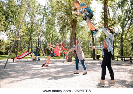 Child being Pushed on Swing Stock Photo: 7558166 - Alamy