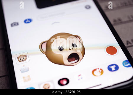 Paris, France - Sep 12, 2019: Latest iPhone 11 Pro featuring multiple Animoji character with face of monkey expressing astonishing face sentiments Stock Photo