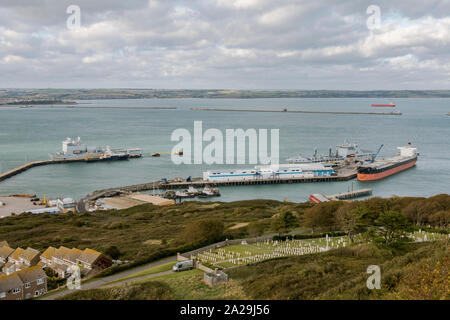 View of the Port of isle of Portland with Chesil beach in background and Port, jurassic coast, Uk. Stock Photo