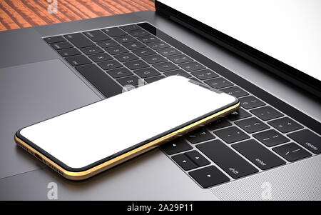 Smartphone and laptop template, isolated on a wooden table. Mockup. Stock Photo