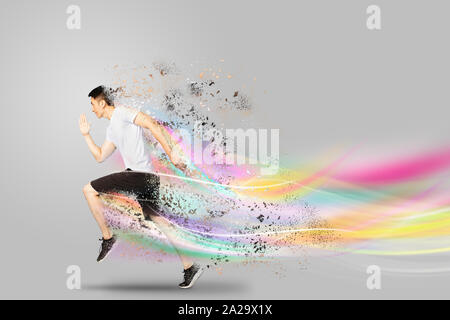 Young man running forward with speed concepts Stock Photo