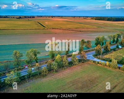 Beautiful panoramic aerial drone view to view of fields in eastern Poland at sunset, near Bialowieza Forest - near of the last and largest remaining p Stock Photo