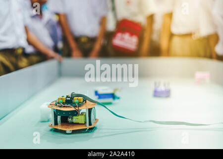 Students are testing robot control in an elementary school laboratory. Stock Photo