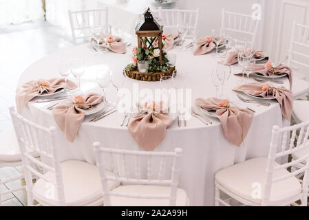 Wedding table service for reception of guests. Decoration in rustic style Stock Photo