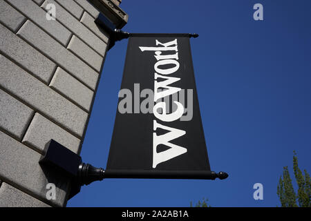 Portland, OR, USA - Sep 6, 2019: The WeWork banner outside a WeWork coworking space location in US Custom House in downtown Portland's Pearl District. Stock Photo