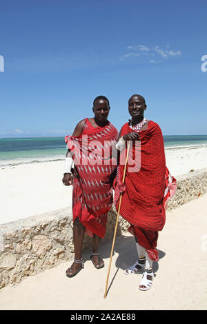 Two Maasai men standing on the beach, Zanzibar, Unguja Island, Tanzania. Stock Photo