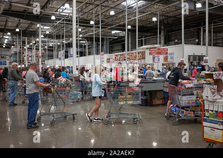 Shoppers line up at the checkout lanes in a Costco Wholesale store in Tigard, Oregon, on Monday, Sep 16, 2019. Stock Photo
